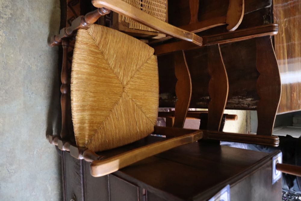 A pair of beech rush seat elbow chairs and a pair of 19th century French fruitwood chairs